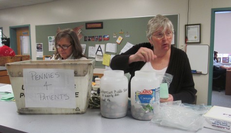 Laurie Brackett (left) and Eleanor Donato count the first round of donations at Watertown Middle School during the annual Pennies for Patients drive to help the Leukemia & Lymphoma Society in its fight against cancer. This year's drive runs from March 2 to March 23.