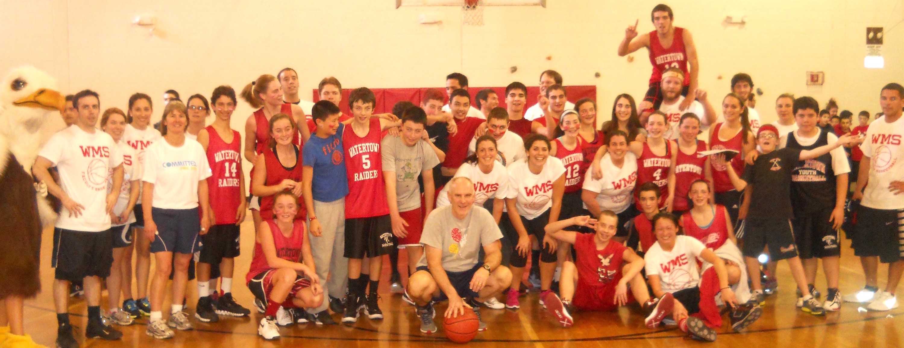 Virginia Walsh (sixth from left, blue shorts) is retiring from Watertown Middle School after 27 years. (2013 Watertown Splash file photo)