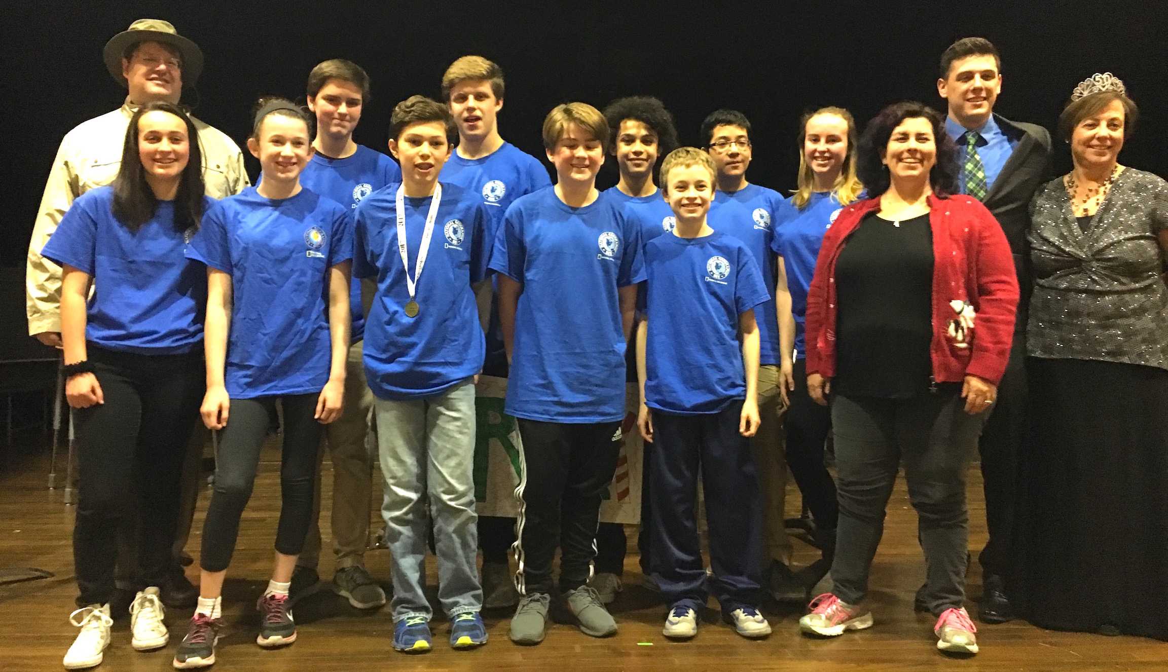The finalists and organizers pose with Henry Yusem (wearing ribbon and medal) after he won the annual Geography Bee at Watertown Middle School on Dec. 23, 2016.