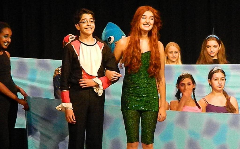 Prince Eric (Hakeem Alhady) and Ariel (Amelia Allison) live happily ever after at the end of the Watertown Middle School production of The Little Mermaid on Dec. 5, 2013.
