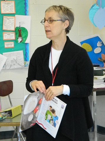 Author Sally Sampson holds a copy of her ChopChop magazine during her recent visit to Watertown Middle School.
