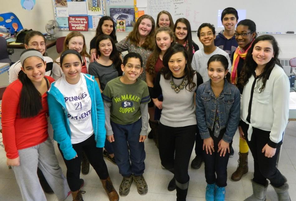 Ch. 7 news reporter Susan Tran (front, with necklace) poses with reporters from the Watertown Splash during her visit to Watertown Middle School on March 12, 2014.