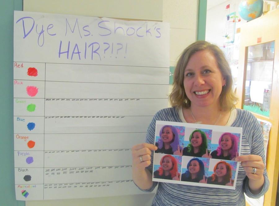 Laura Shock, an eighth-grade humanities teacher at Watertown Middle School, shows off examples of what her hair could like as a result of the current contest, one of the many fund-raisers for the annual Pennies for Patients drive to help the Leukemia & Lymphoma Society in its fight against cancer. This years drive runs from March 2 to March 23.