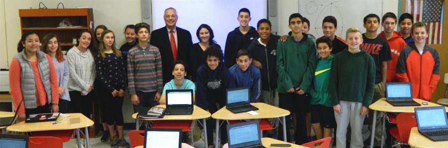 Dr. John Brackett (standing with tie) poses with reporters from the Watertown Splash after an interview in the newsroom at Watertown Middle School on Nov. 16, 2016. 