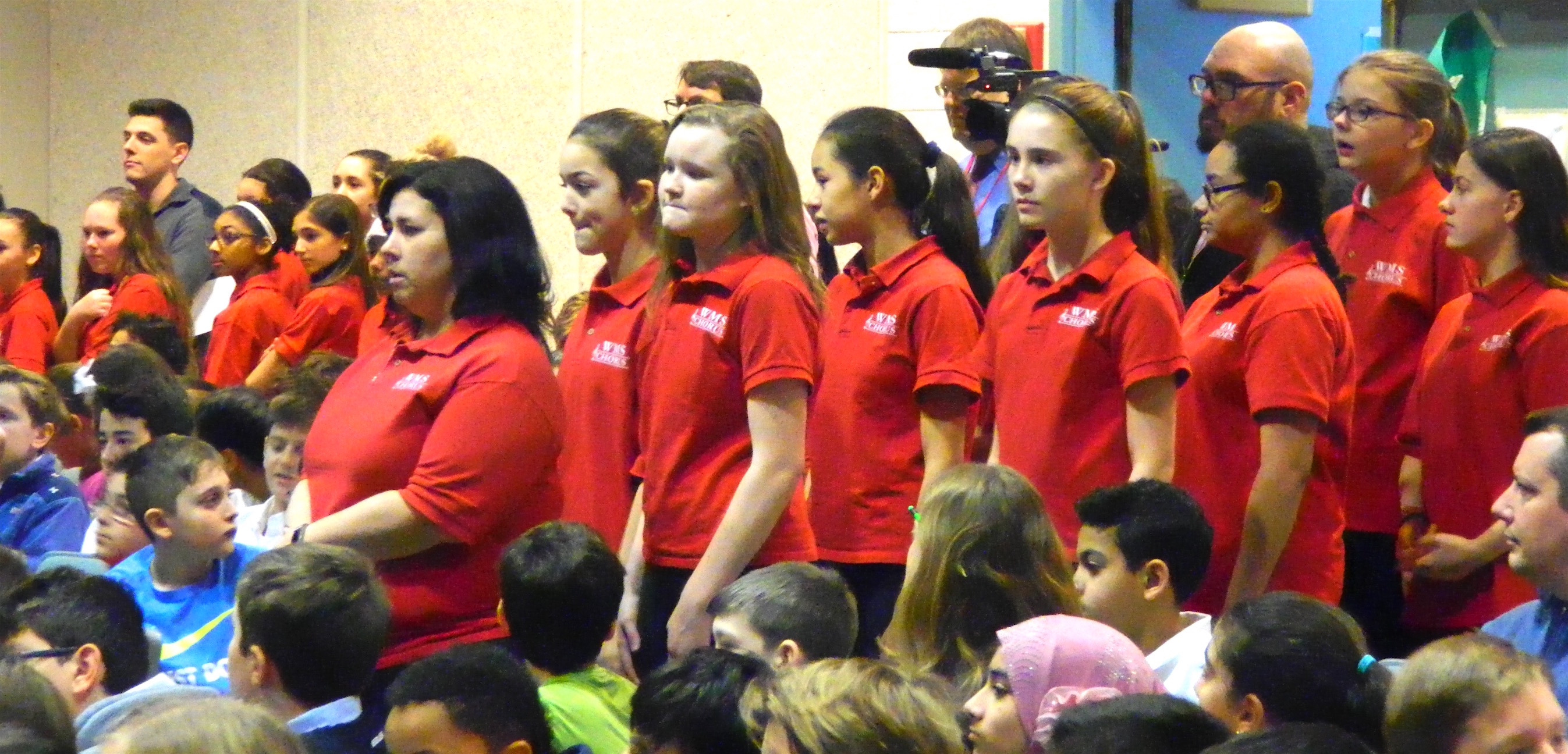 Abby Casey (front left) led the Watertown Middle School chorus in the two Winter Concert performances, Dec. 13 and 16, 2016.
