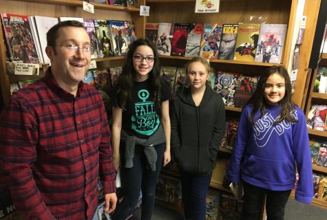 Store owner David Philbrick (left) poses with reporters from the Watertown Splash after a recent interview at The Comic Stop at 134 Main St. in Watertown, Mass.