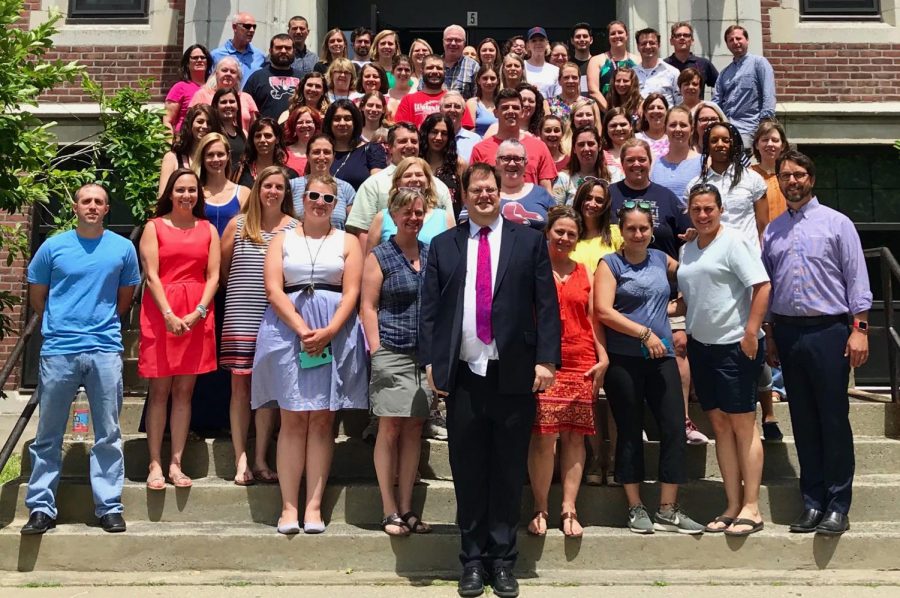 The staff of Watertown Middle School poses for a photo with Kimo Carter (front row, center) on June 22, 2018, his last day as principal after 13 years.