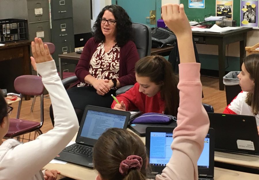 New Watertown Middle School principal Donna Martin answers questions from student reporters during a recent interview in the Watertown Splash newsroom.