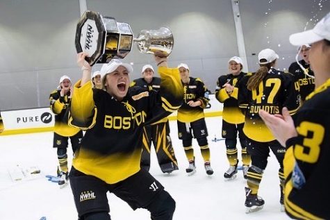 Lauren Kelly of the Boston Pride (and Watertown Middle School) celebrates with the Isobel Cup after Boston beat the Minnesota Whitecaps, 4-3, for the NWHL title on March 27, 2021, at Warrior Ice Arena.